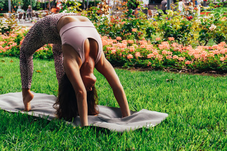 Young yogi performing bridge poseの写真素材