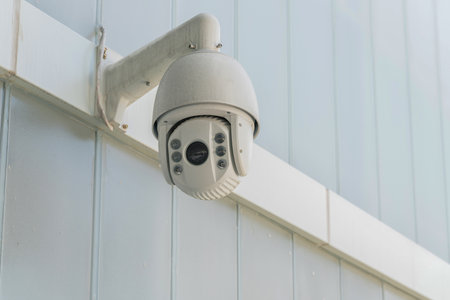 close up view of  cctv camera  on the wall of modern building