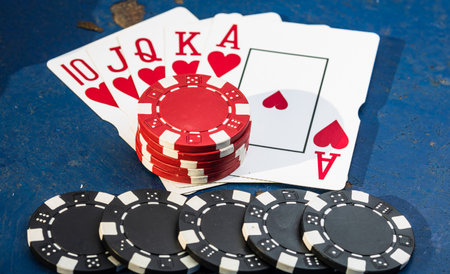 Stacks of poker chips with money and cards
