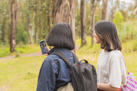 Young man walking with his pet through nature.の写真素材