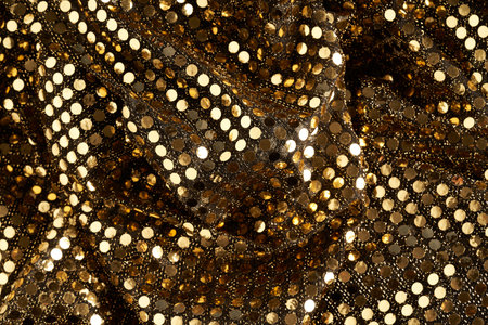 golden fabric with sequins for wallpaper backgroundの写真素材
