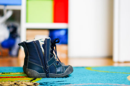 Child leather shoe with open zipperの写真素材