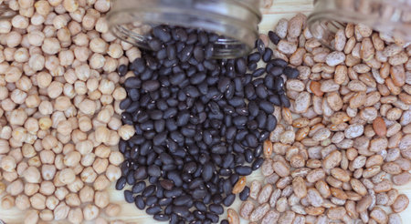 Black-eyed Peas, Chick Peas, Black Beans and Pinto Beans Spilled in Kitchenの写真素材