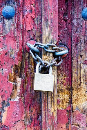 padlock in an old doorの写真素材