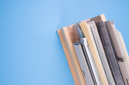 wood holder of files and documents isolated on blue background with free spaceの写真素材