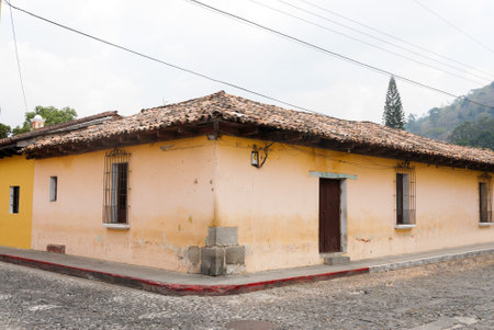 Detail of colonial architecture, houses with Spanish heritage architecture, colorful facades in the colonial city of La Antigua Guatemala.のeditorial素材