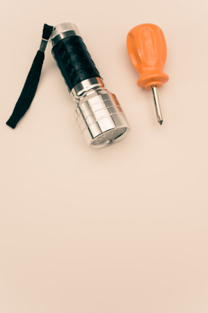 shot of a led fleshlight with screwdriver on color background with text spaceの写真素材