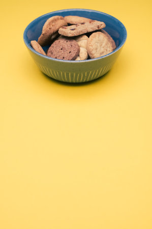 A vertical shot of  bio sweet biscuits on a colored backgroundの写真素材
