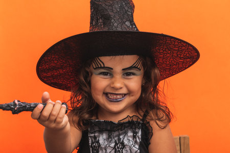 Little girl dressed as a witch for Halloweenの写真素材
