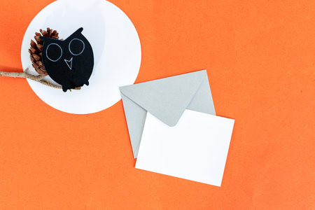 Halloween background with owl, card and envelope, on orange background.の写真素材