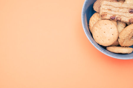A vertical shot of  bio sweet biscuits on a colored backgroundの写真素材
