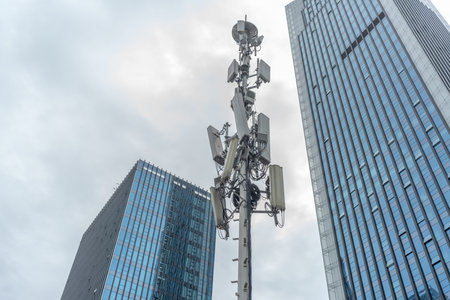 5g transmittion tower with modern buildings and sky for copy space.の写真素材