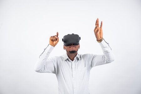 young nigerian man using a vr headsetの写真素材