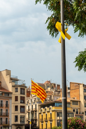 Girona medieval city, yellow elements and ties in solidarity with the political conflict, Catalonia's Costa Brava in the Mediterranean. Spainの写真素材