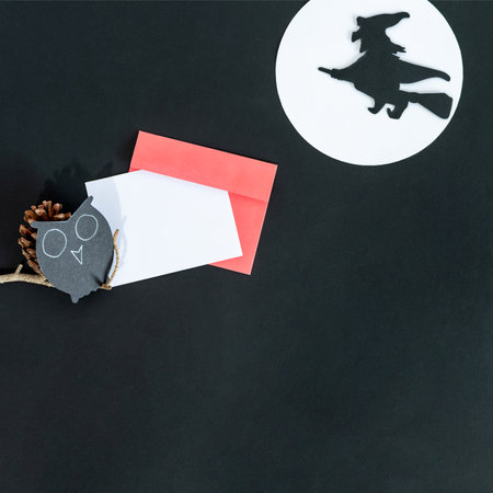Halloween holiday invitation with witch on black background.の写真素材