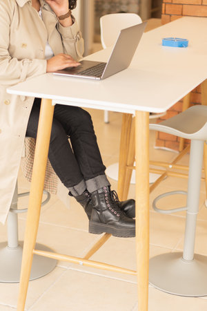 Young woman working, in a coworking space and video conferencing.の写真素材