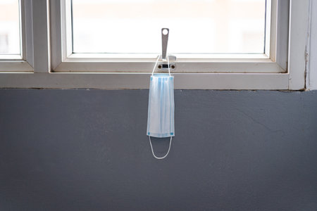 A used protective facemask scattered and unwell-managed in the building