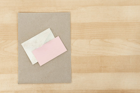 Minimalist Wedding Invitation Template, on wooden desk.