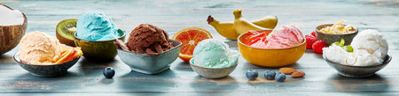 Ice cream scoops with various flavors served in bowl on table with fresh fruits and berries