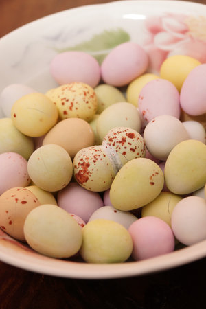 A mix of chocolate eggs in a small bowl