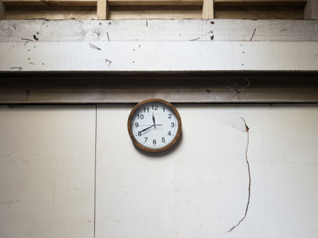 Analogue clock on a broken wall