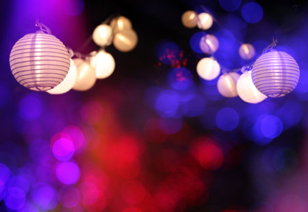 Asian party lanterns at night with colorful bokeh