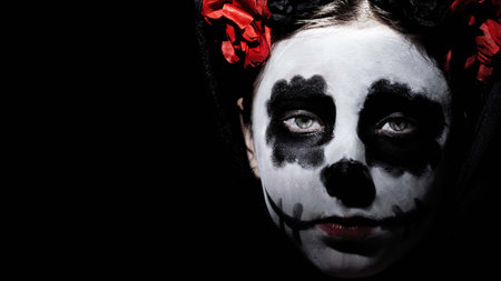 Closeup portrait of Calavera Catrina. Young woman with sugar skull makeup. Dia de los muertos. Day...