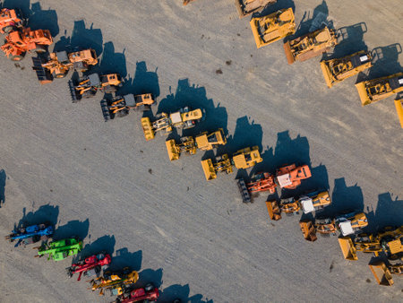 An aerial view of perfect rows of wheel loaders and other heavy machineryのeditorial素材