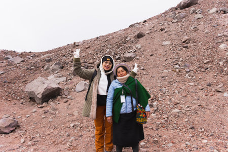Female local tourist guide from an indigenous community, showing tourists the beauty of nature and...