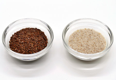 Psyllium and linseed in transparent bowls, detailed view in a photo boxの写真素材