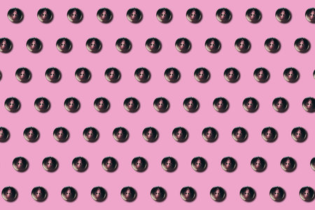 Sewing buttons pattern on pink background in flat lay style. Concept for fashion, design,...