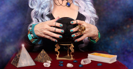 Psychic with Crystal Ball. and tarot cards on Galaxy Backgroundの写真素材