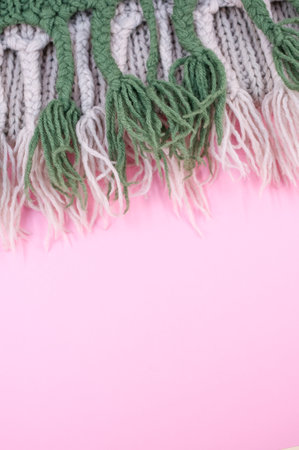 hand knitted soft wool on a pink background with copy spaceの写真素材