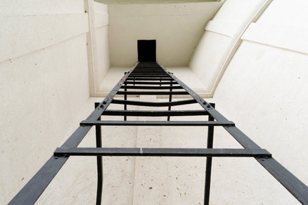 tall metal ladder going up - POVの写真素材