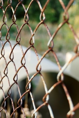 An old rusty fence to protect building materials