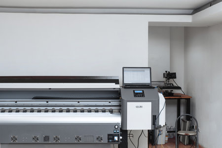 large format plotter with a laptop on top. impression concept.の写真素材