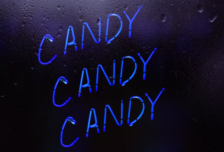 Candy Candy Candy Neon Sign in Rainy Window Candy Shop Window