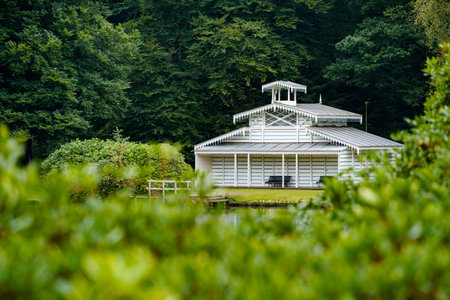 This photo was taken in the royal park of 't Loo Palace near Apeldoorn in the Netherlands. This is a Boathouse that was used by three generations of queens. it was built in the late 18th century by the royal family.の写真素材