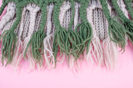 hand knitted soft wool on a pink background with copy spaceの写真素材