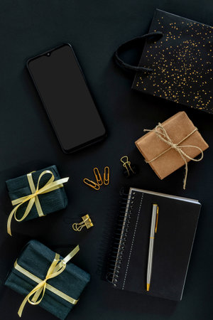 cellphone with gift box and shopping bag black friday concept.の写真素材