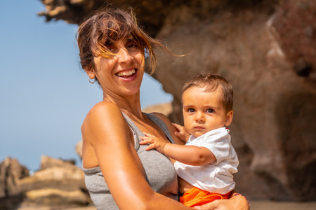 Portrait of a young mother enjoying holidays by the sea in Playa de Garcey, west coast of Fuerteventura, Canary Islands. Spainの写真素材