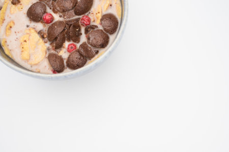 Fresh tasty breakfast with milk and chocolate cereal with copy spaceの写真素材