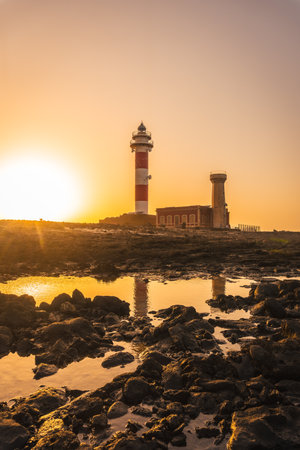 Sunset at the Toston Lighthouse near the sea, Punta Ballena near the town of El Cotillo, Fuerteventura island, Canary Islands. Spainの写真素材