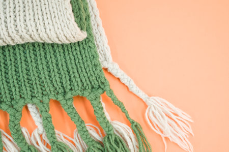 hand knitted soft wool on an orange background with copy spaceの写真素材