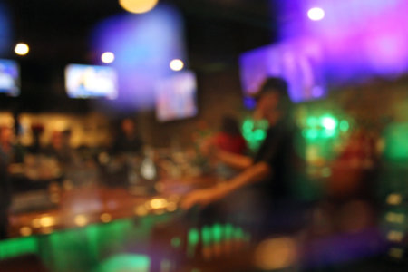 Sports Bar Blur Background Interior with Colorful Lightsの写真素材