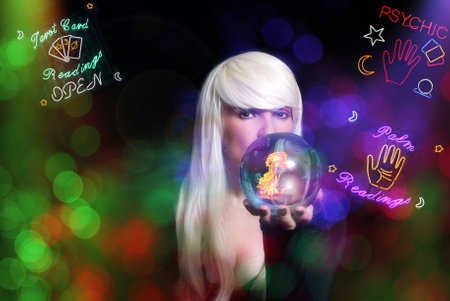 Psychic with Blond hair and Crystal Ball. Vintage Neon Lights in backgroundの写真素材