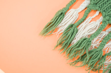 hand knitted soft wool on an orange background with copy spaceの写真素材