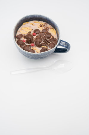 Fresh tasty breakfast with milk and chocolate cereal with copy spaceの写真素材