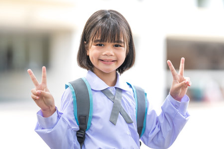 Portrait of children student in uniform and backpack Looking at camera going back to school after covid-19 quarantine and lockdown. Back to School Concept Stock Photoの写真素材