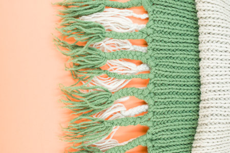 hand knitted soft wool on an orange background with copy spaceの写真素材
